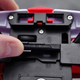 A built-in adapter accommodates smaller smartphones like the iPhone 5.